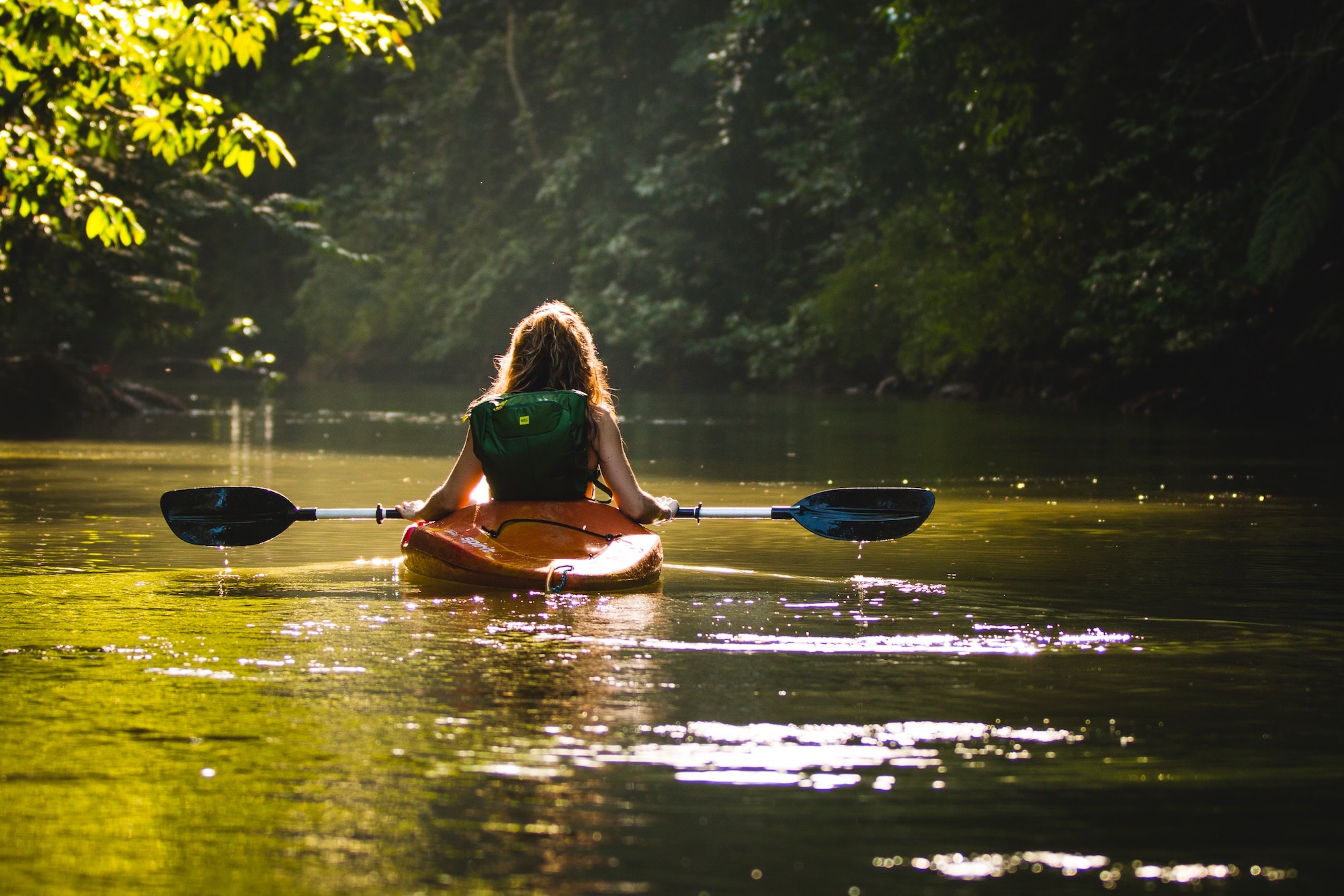 A woman kayaking at The Great Calusa Blueway Paddling Trail