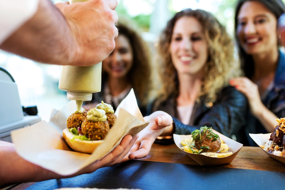 friends enjoy food truck